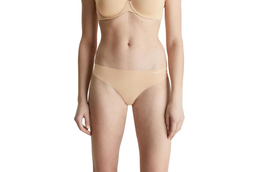 Calvin Klein Women's Invisibles Thong (Light Caramel, Size S)