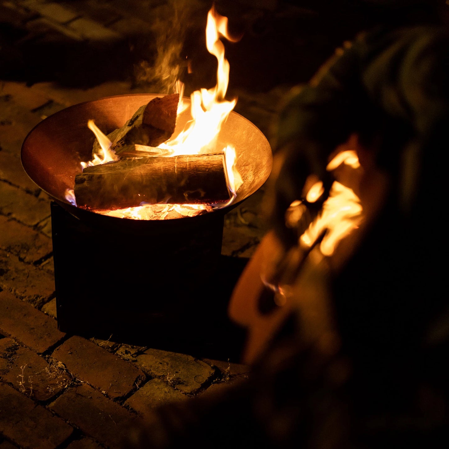 Glow Tambo Weathering Steel Fire Pit with Log Storage for Outdoor Use