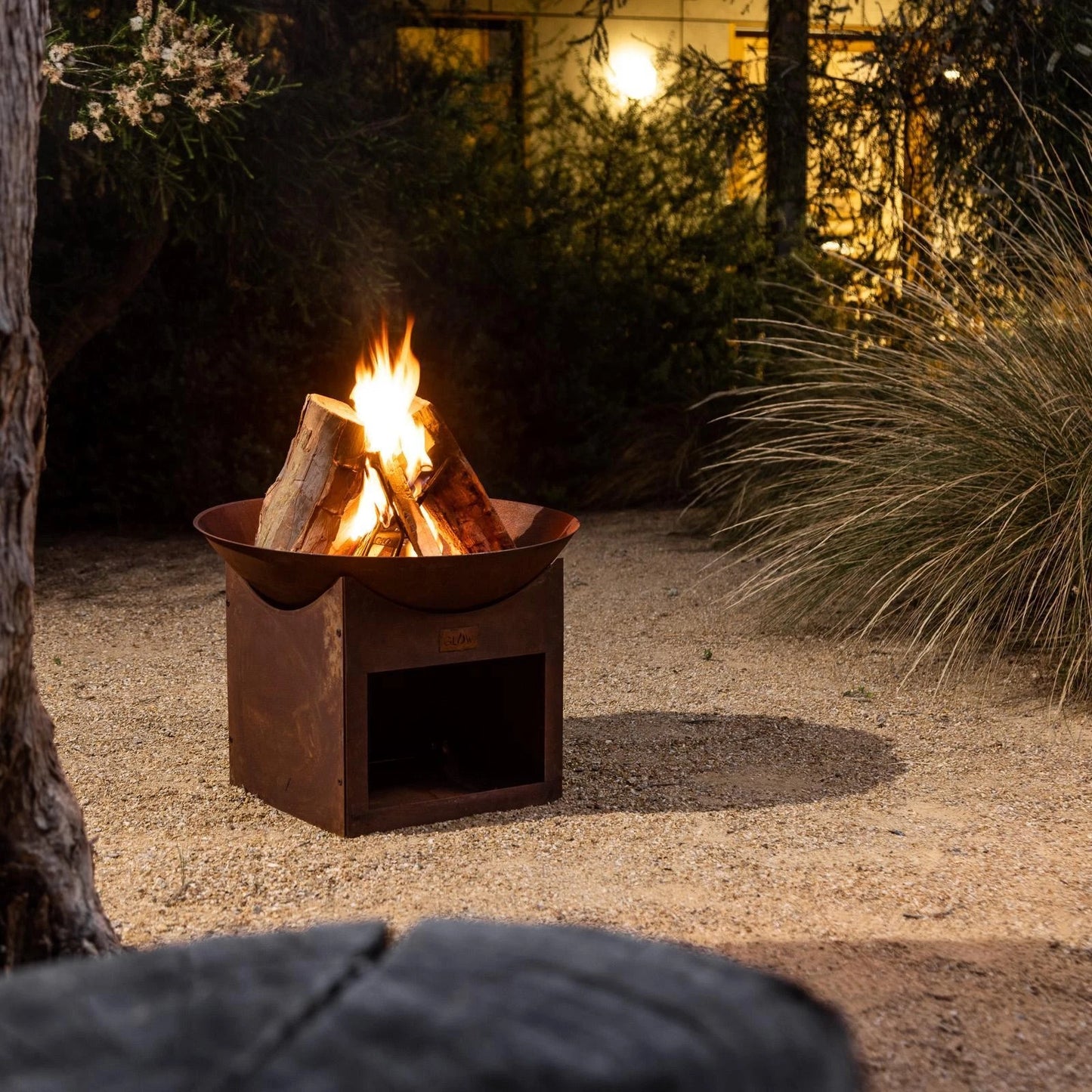 Glow Tambo Weathering Steel Fire Pit with Log Storage for Outdoor Use