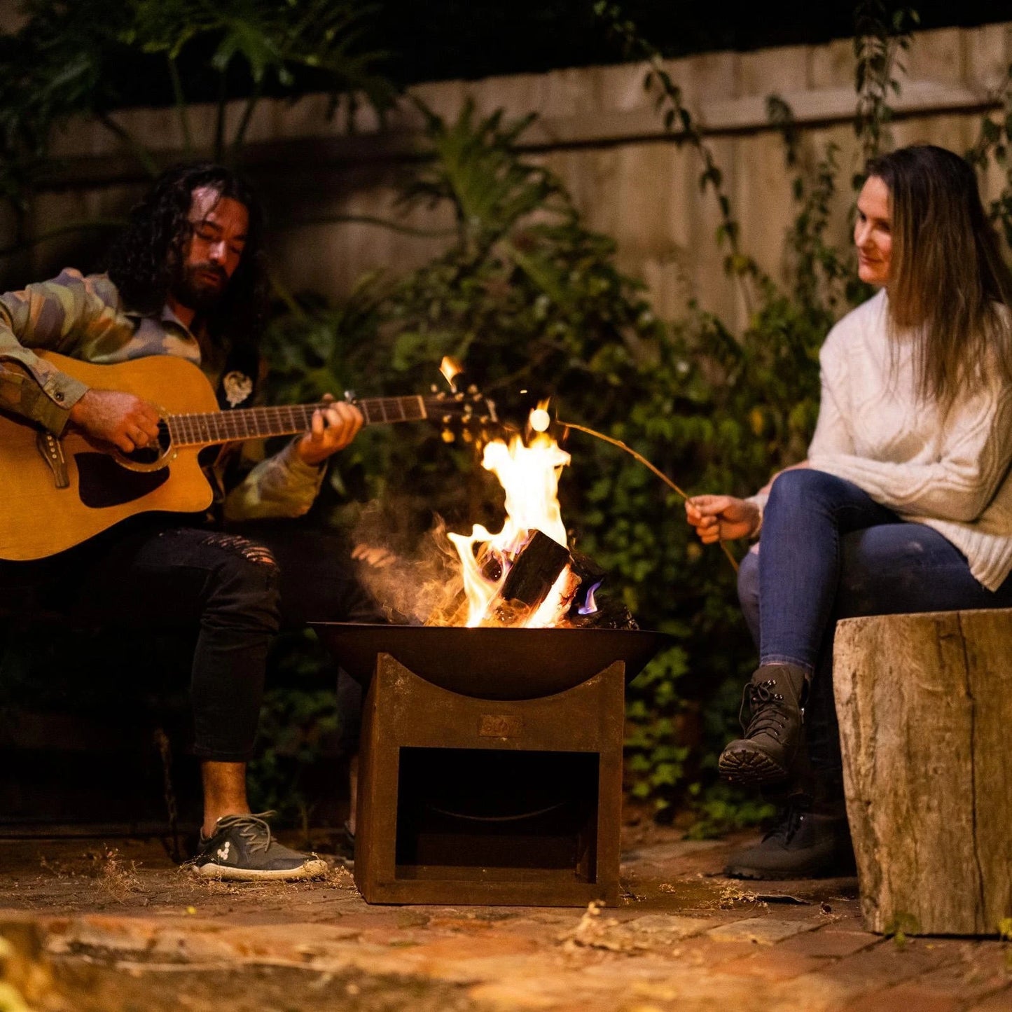 Glow Tambo Weathering Steel Fire Pit with Log Storage for Outdoor Use